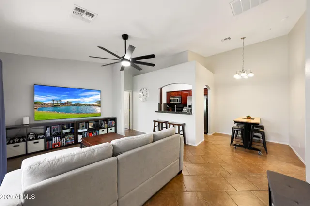 a kitchen with granite countertop stainless steel appliances and wooden cabinets