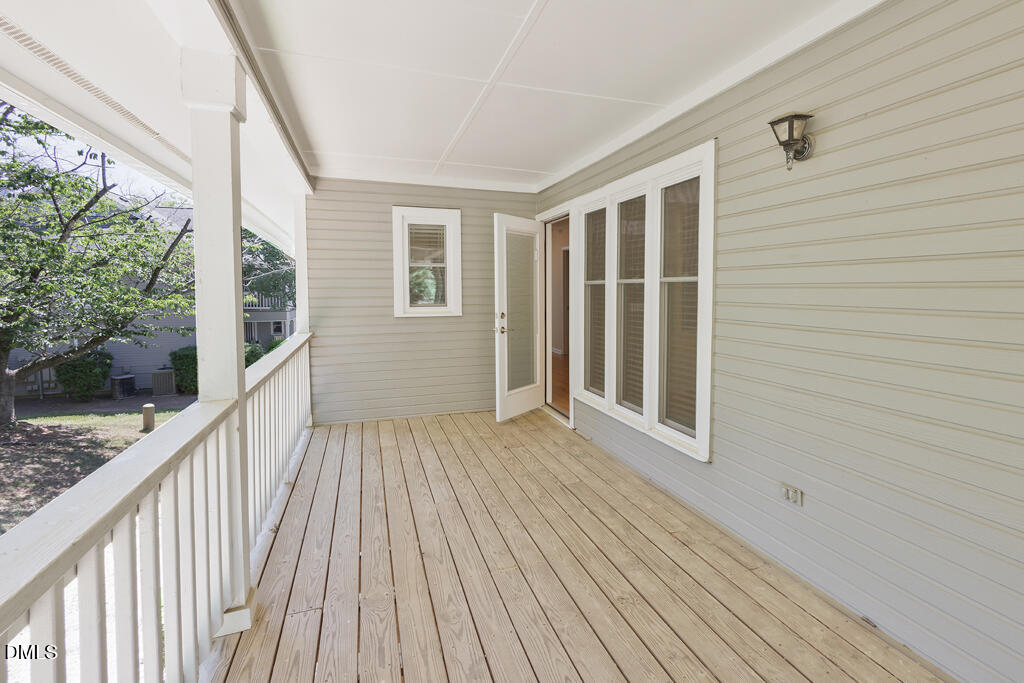 2831 Edridge Court, Unit 202 Raleigh, NC 27612 - Photo 16 of 33 a view of balcony with wooden floor
