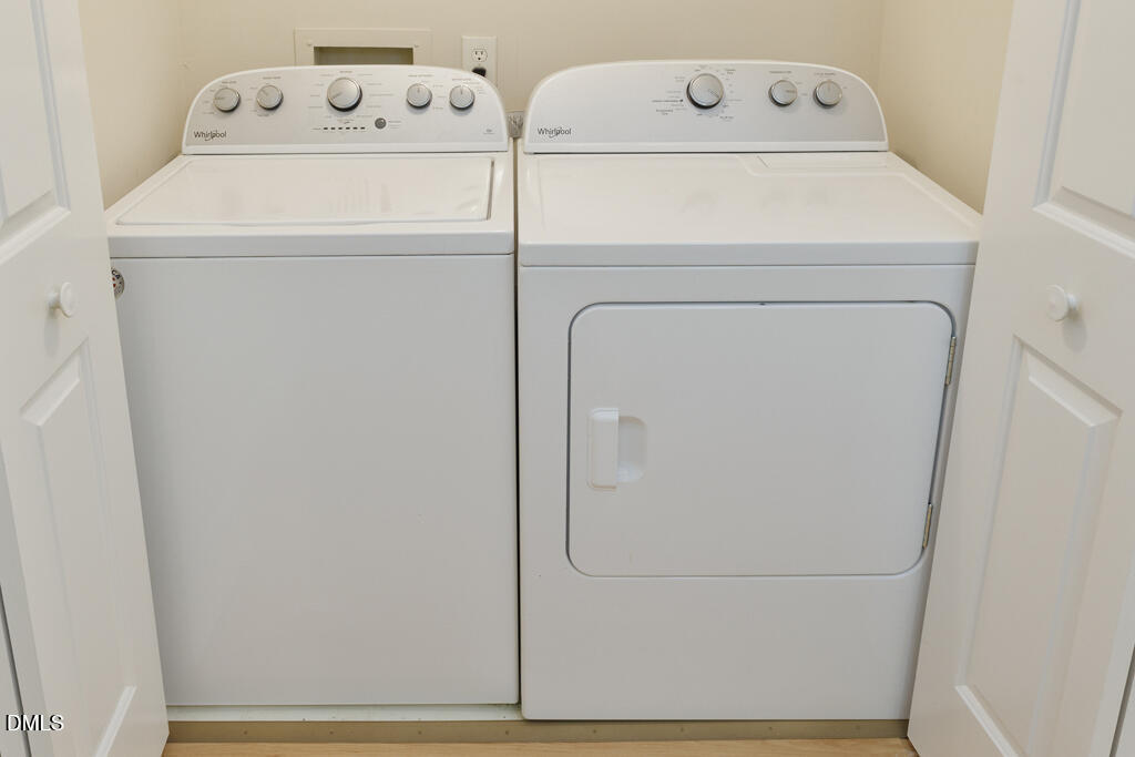 2831 Edridge Court, Unit 202 Raleigh, NC 27612 - Photo 26 of 33 a utility room with dryer and washer