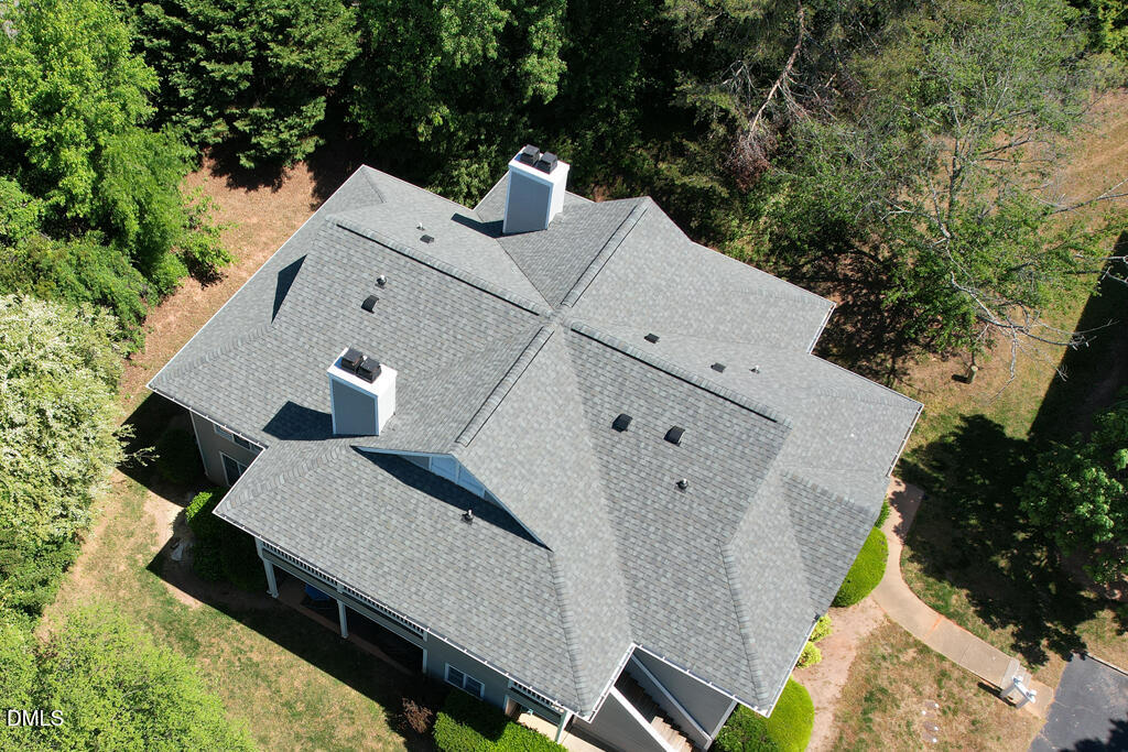 2831 Edridge Court, Unit 202 Raleigh, NC 27612 - Photo 27 of 33 an aerial view of a house with swimming pool and wooden fence