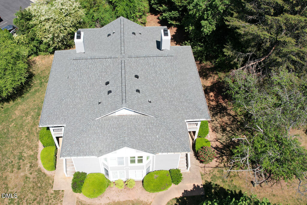2831 Edridge Court, Unit 202 Raleigh, NC 27612 - Photo 28 of 33 an aerial view of a house with swimming pool and large trees