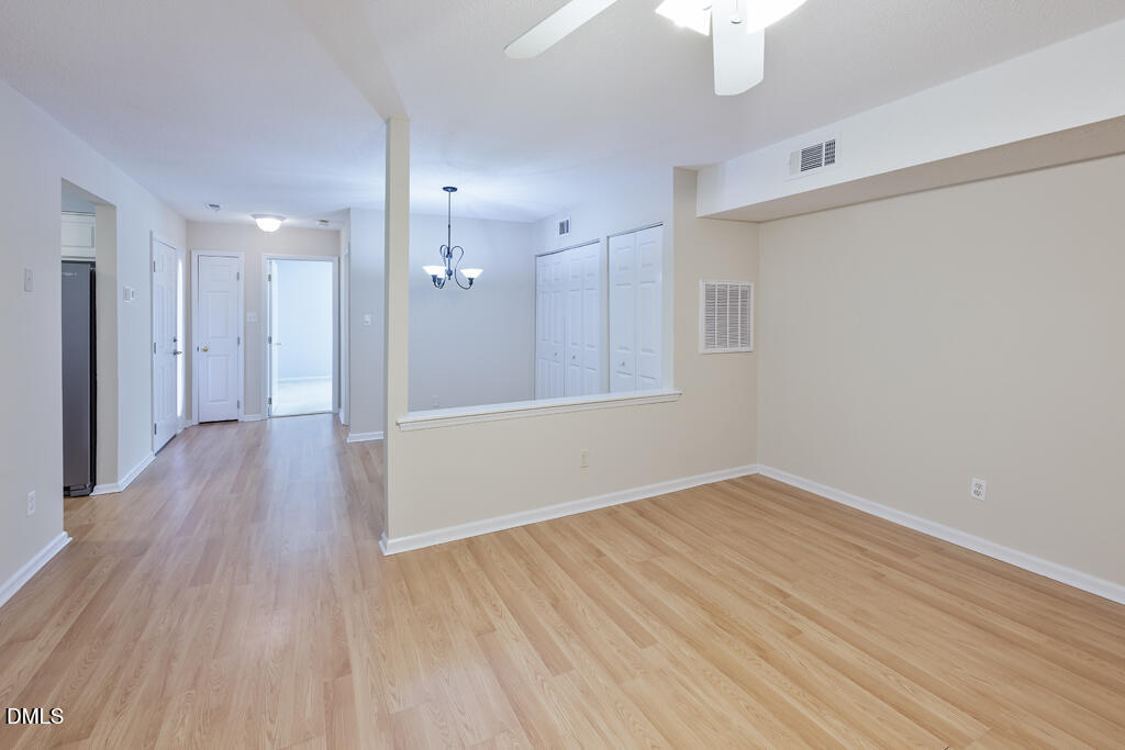 2831 Edridge Court, Unit 202 Raleigh, NC 27612 - Photo 9 of 33 a view of a hallway with wooden floor