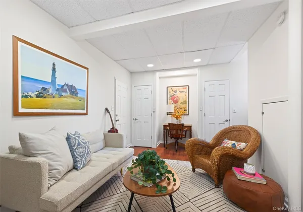 a bathroom with a sink mirror and toilet