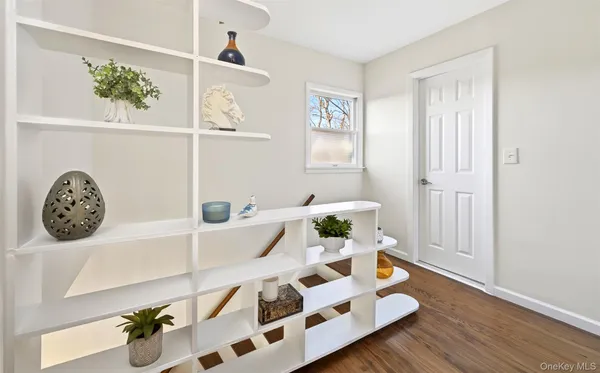 a bedroom with a bed and a lamp