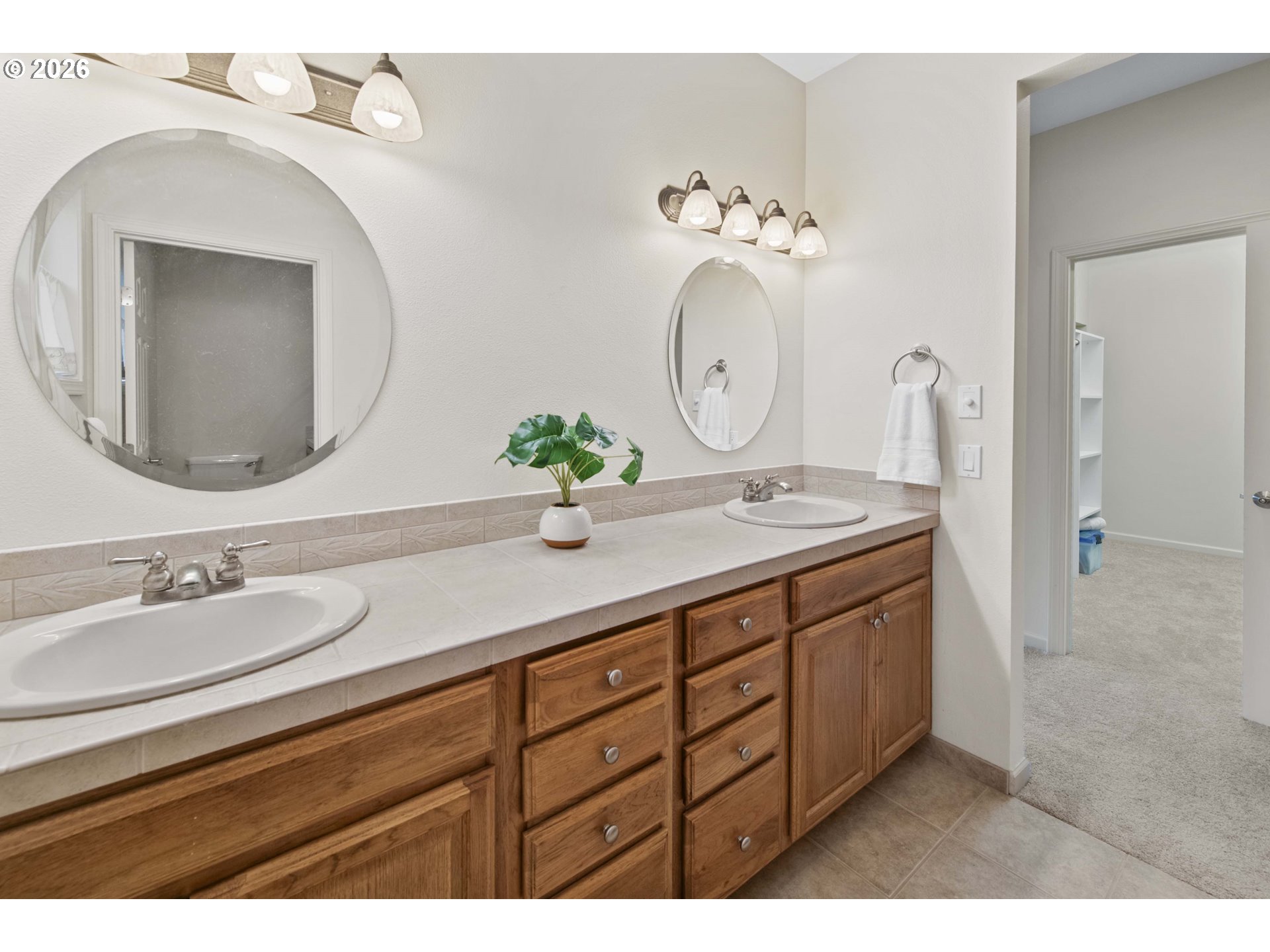 230 Round House Road Astoria, OR 97103 - Photo 24 of 43 a bathroom with a double vanity sink and a mirror