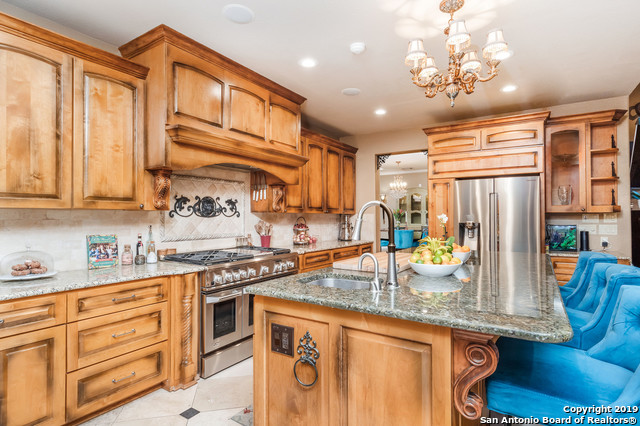 12 South Rue Charles San Antonio, TX 78217 - Photo 1 of 1 a kitchen with stainless steel appliances granite countertop a sink and cabinets