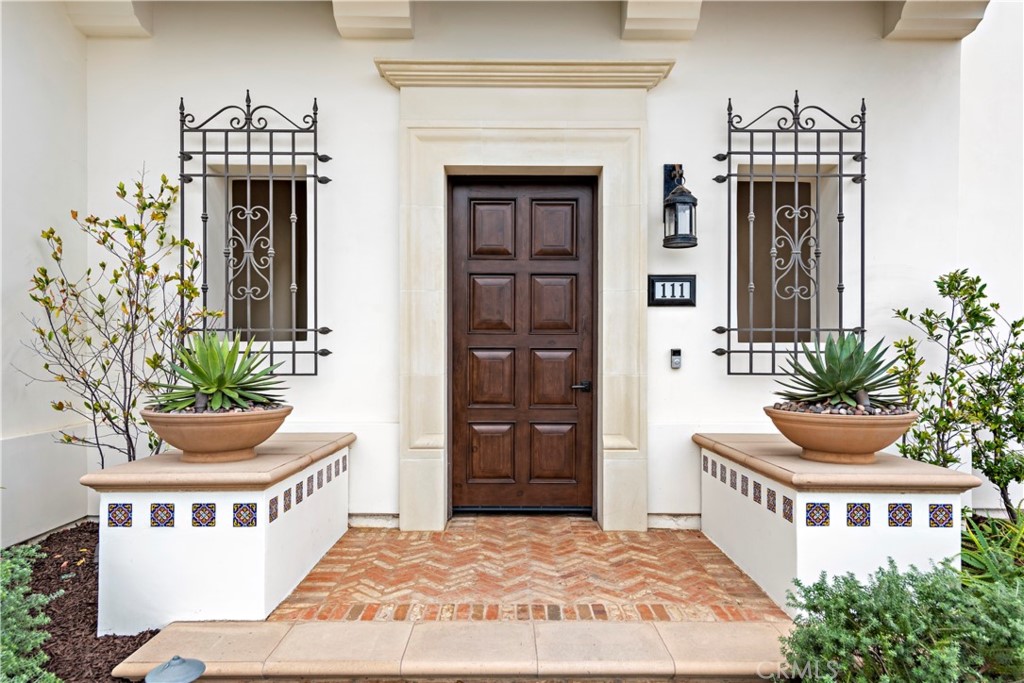 111 Via Escorial San Clemente, CA 92672 - Photo 4 of 5 a front view of a house with potted plants