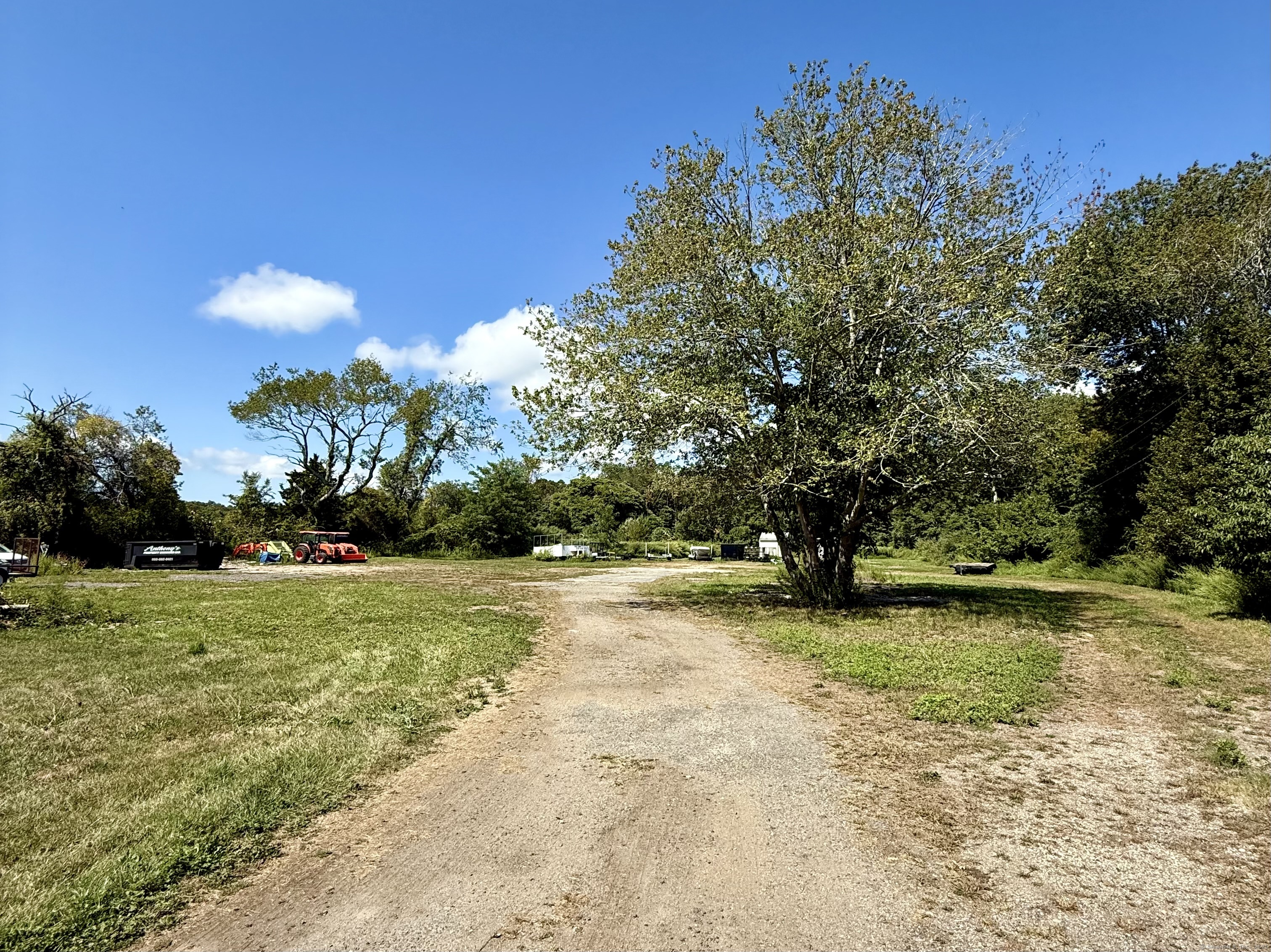 224 Shore Road Old Lyme, CT 06371 - Photo 24 of 25 a view of a field with a tree in the background