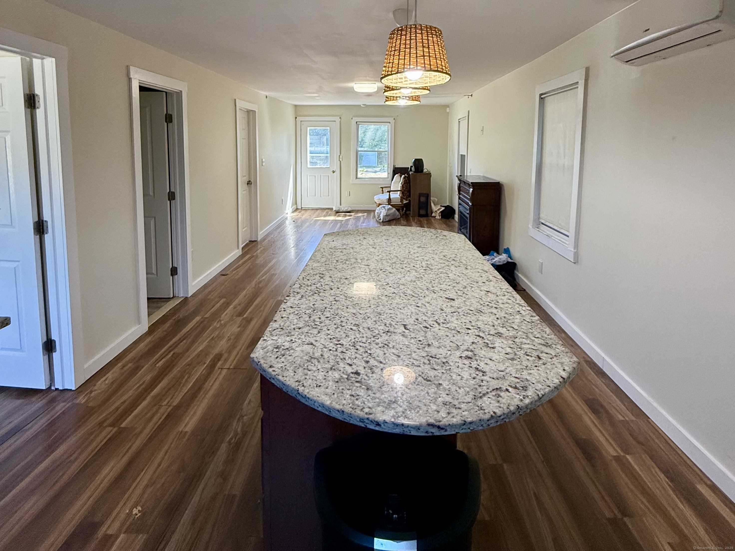 224 Shore Road Old Lyme, CT 06371 - Photo 5 of 25 a view of kitchen island with granite countertop sink and refrigerator