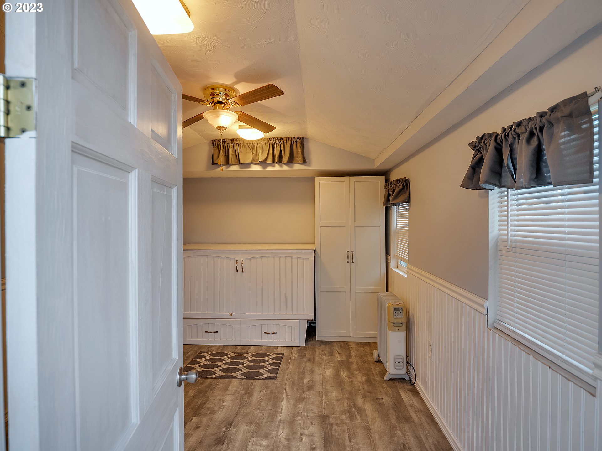 6701 Southeast Hazel Street Portland, OR 97206 - Photo 14 of 20 a view of a porch with wooden floor