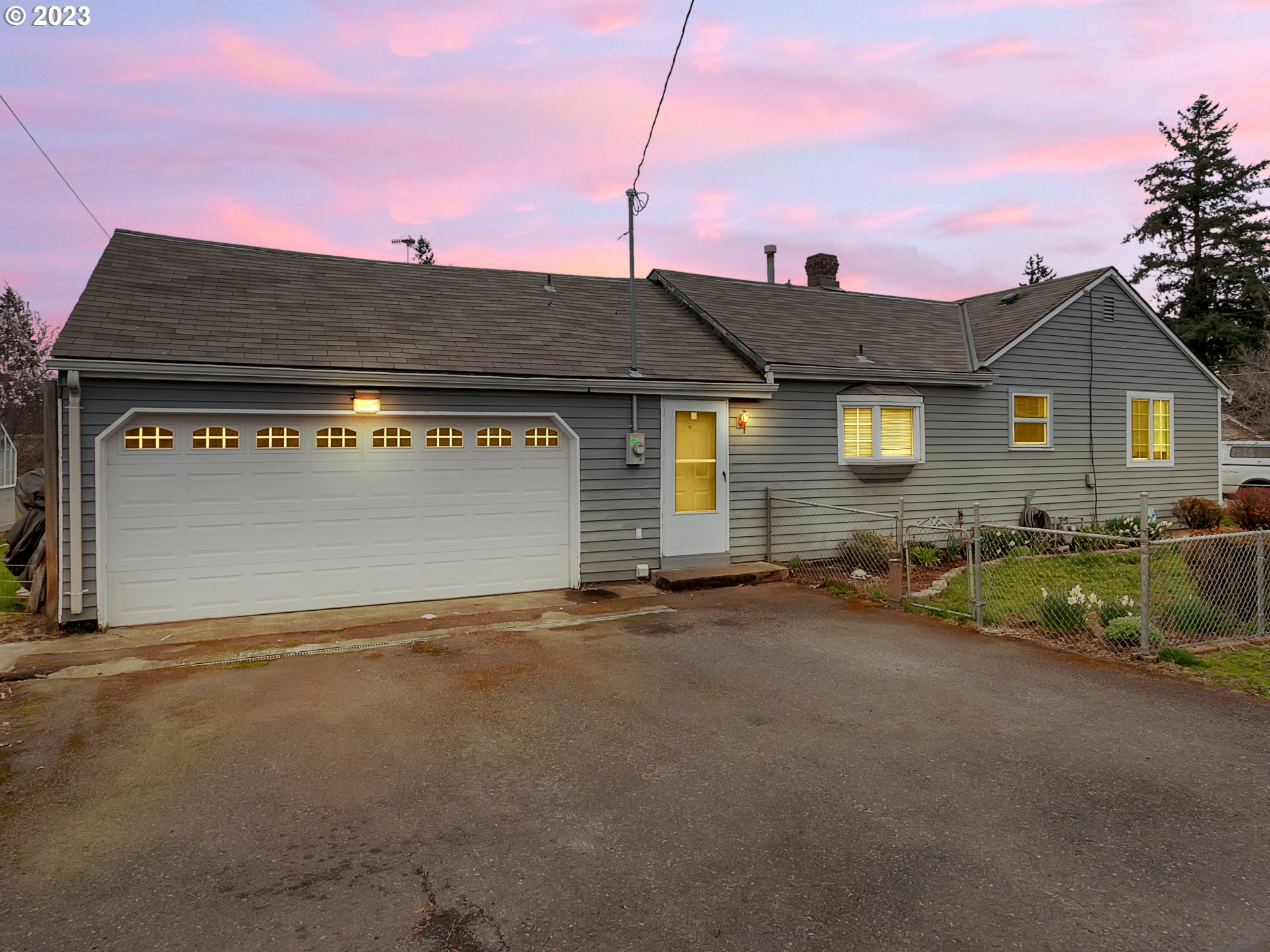 6701 Southeast Hazel Street Portland, OR 97206 - Photo 17 of 20 a backyard of a house with table and chairs