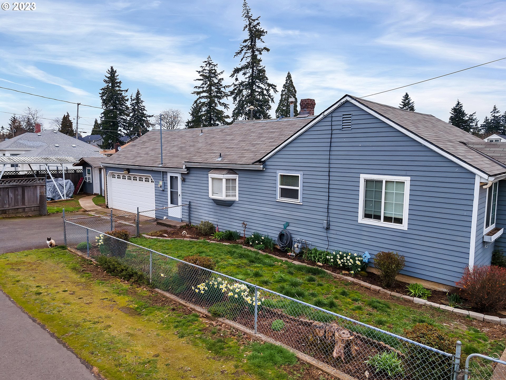 6701 Southeast Hazel Street Portland, OR 97206 - Photo 19 of 20 a front view of a house with a yard