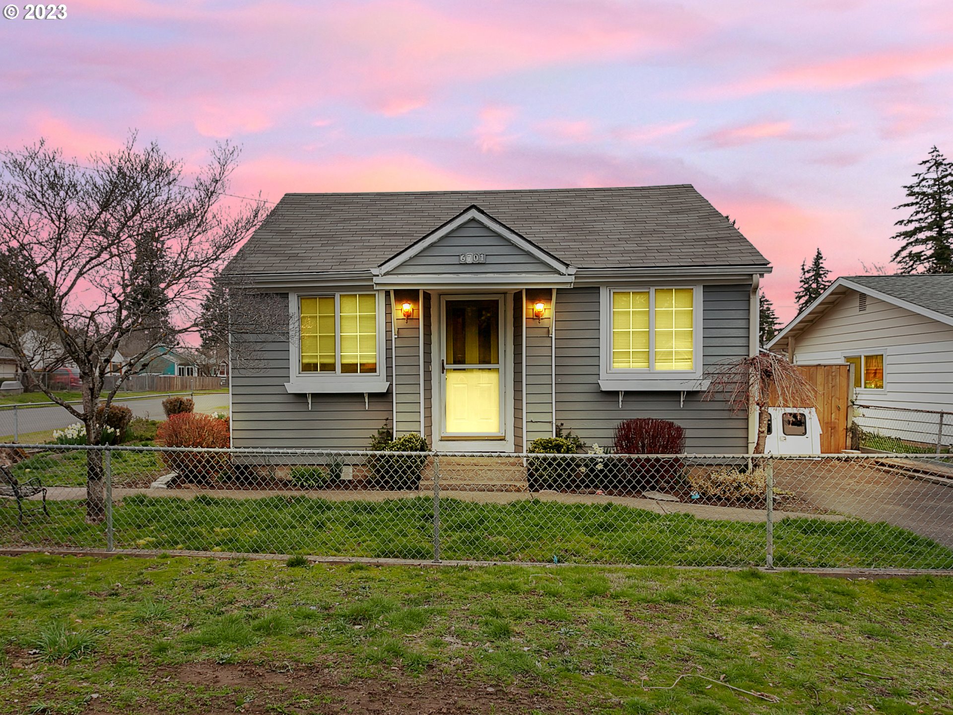 6701 Southeast Hazel Street Portland, OR 97206 - Photo 2 of 20 a front view of a house with a yard