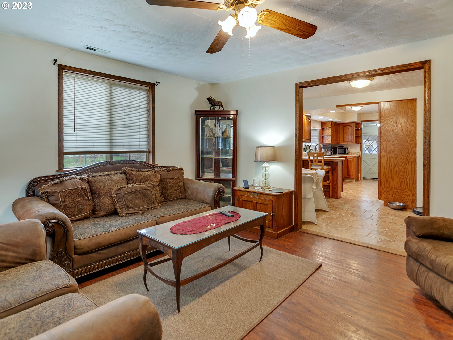 6701 Southeast Hazel Street Portland, OR 97206 - Photo 3 of 20 a living room with furniture and a chandelier