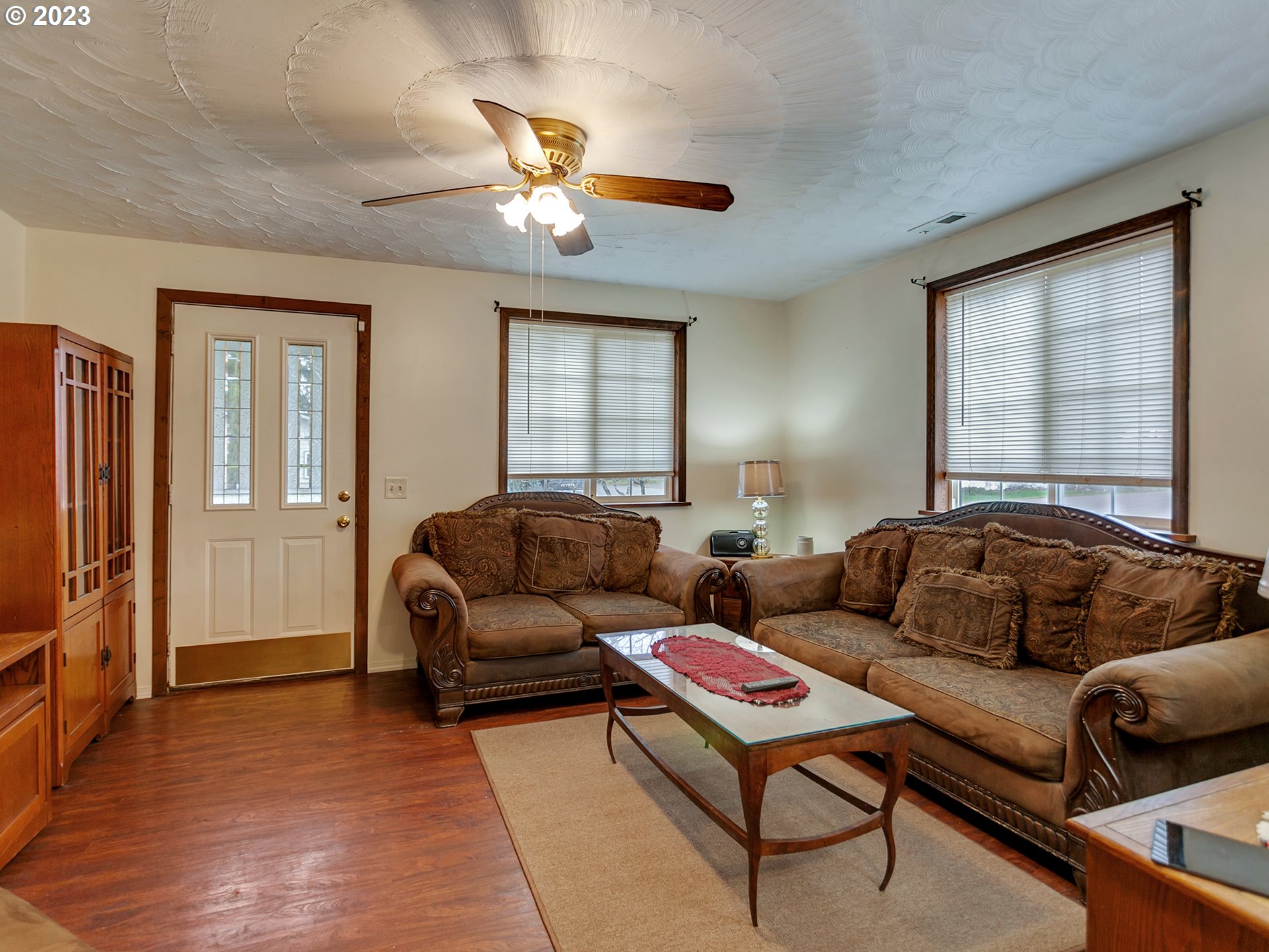 6701 Southeast Hazel Street Portland, OR 97206 - Photo 4 of 20 a living room with furniture and a flat screen tv