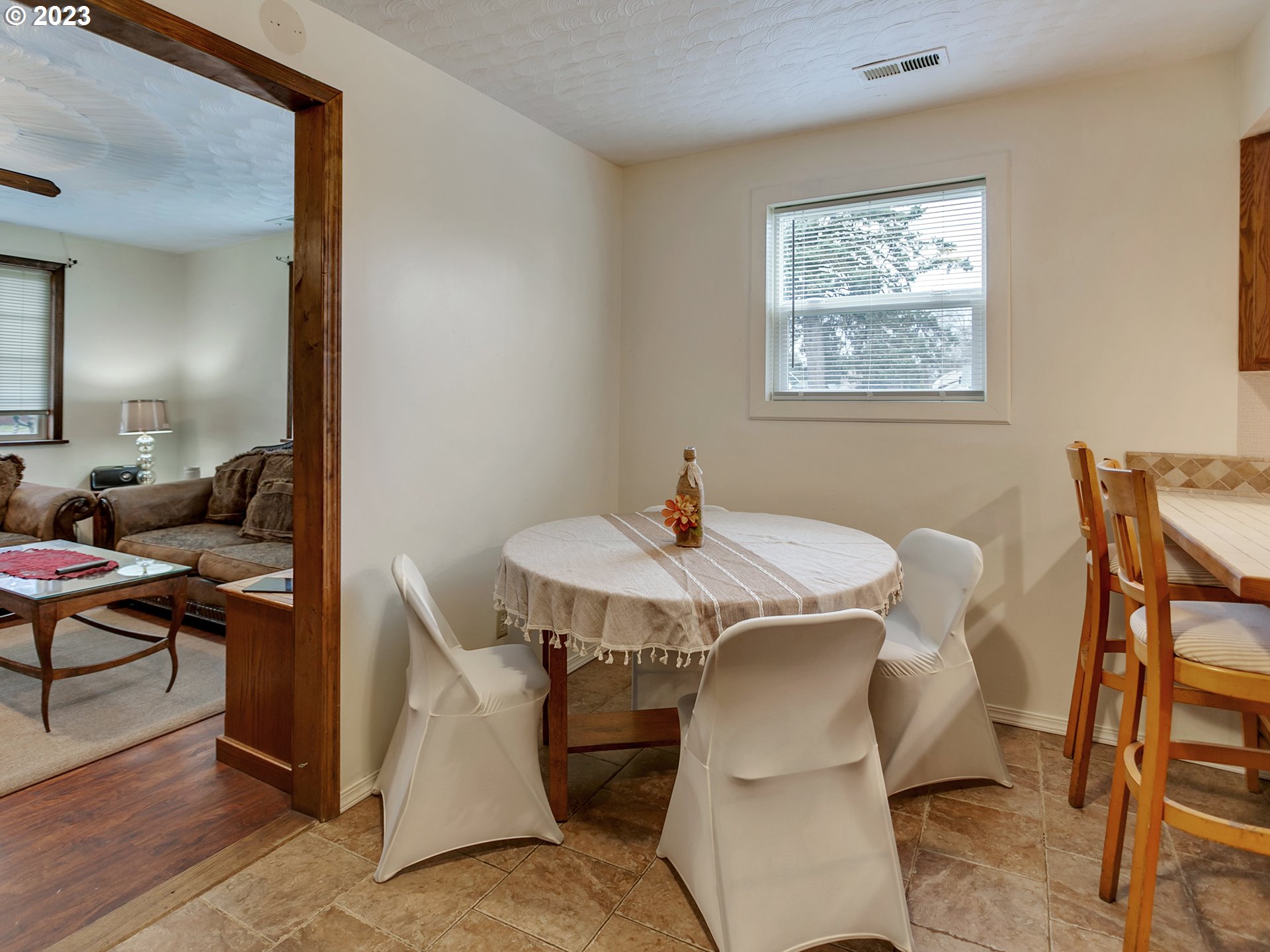 6701 Southeast Hazel Street Portland, OR 97206 - Photo 5 of 20 a view of a dining room with furniture and wooden floor