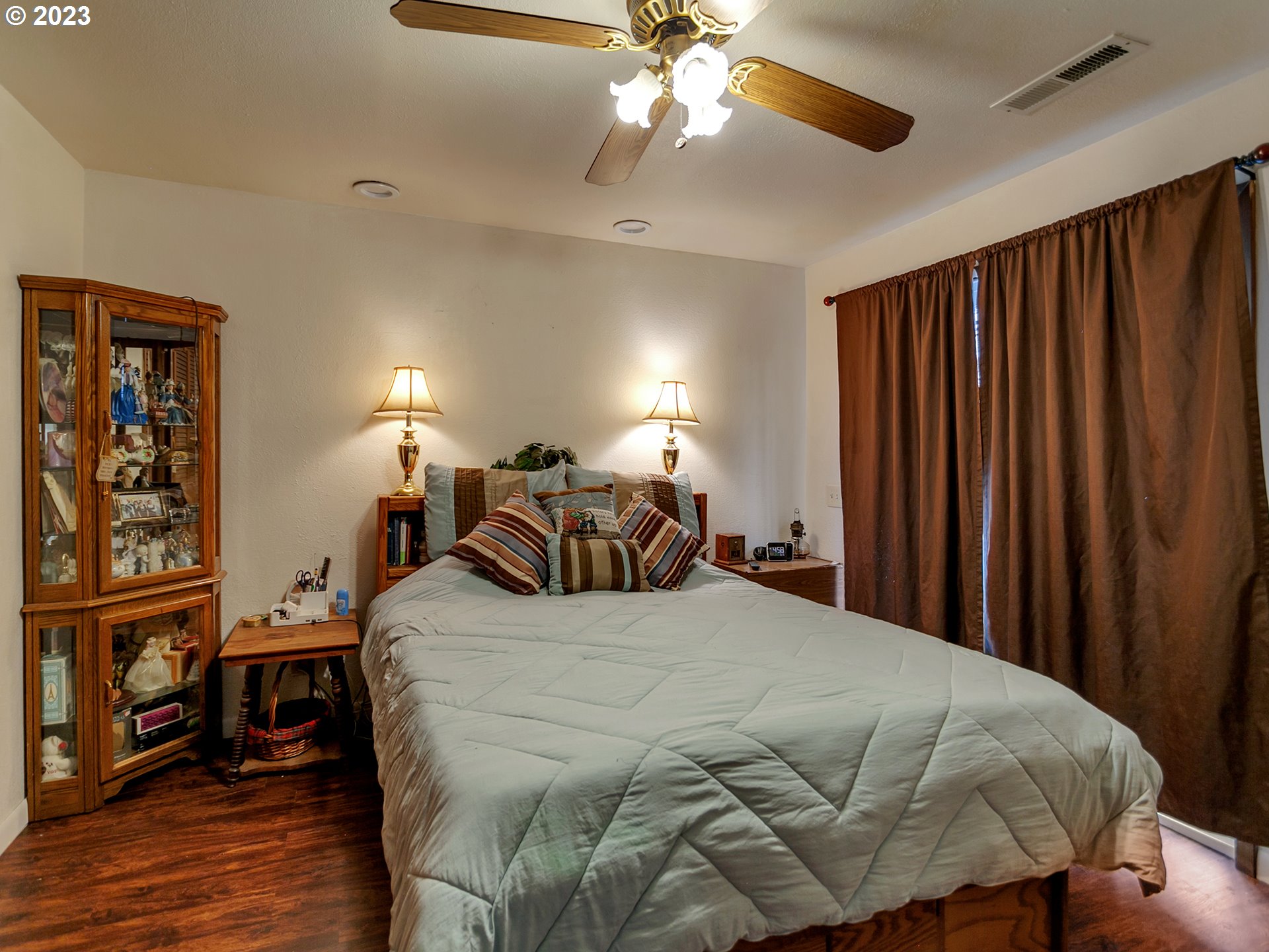 6701 Southeast Hazel Street Portland, OR 97206 - Photo 10 of 20 a bed sitting in a bedroom next to a window