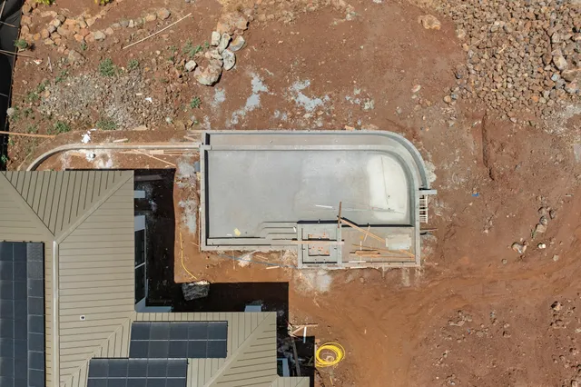 a view of a chairs and table in the patio