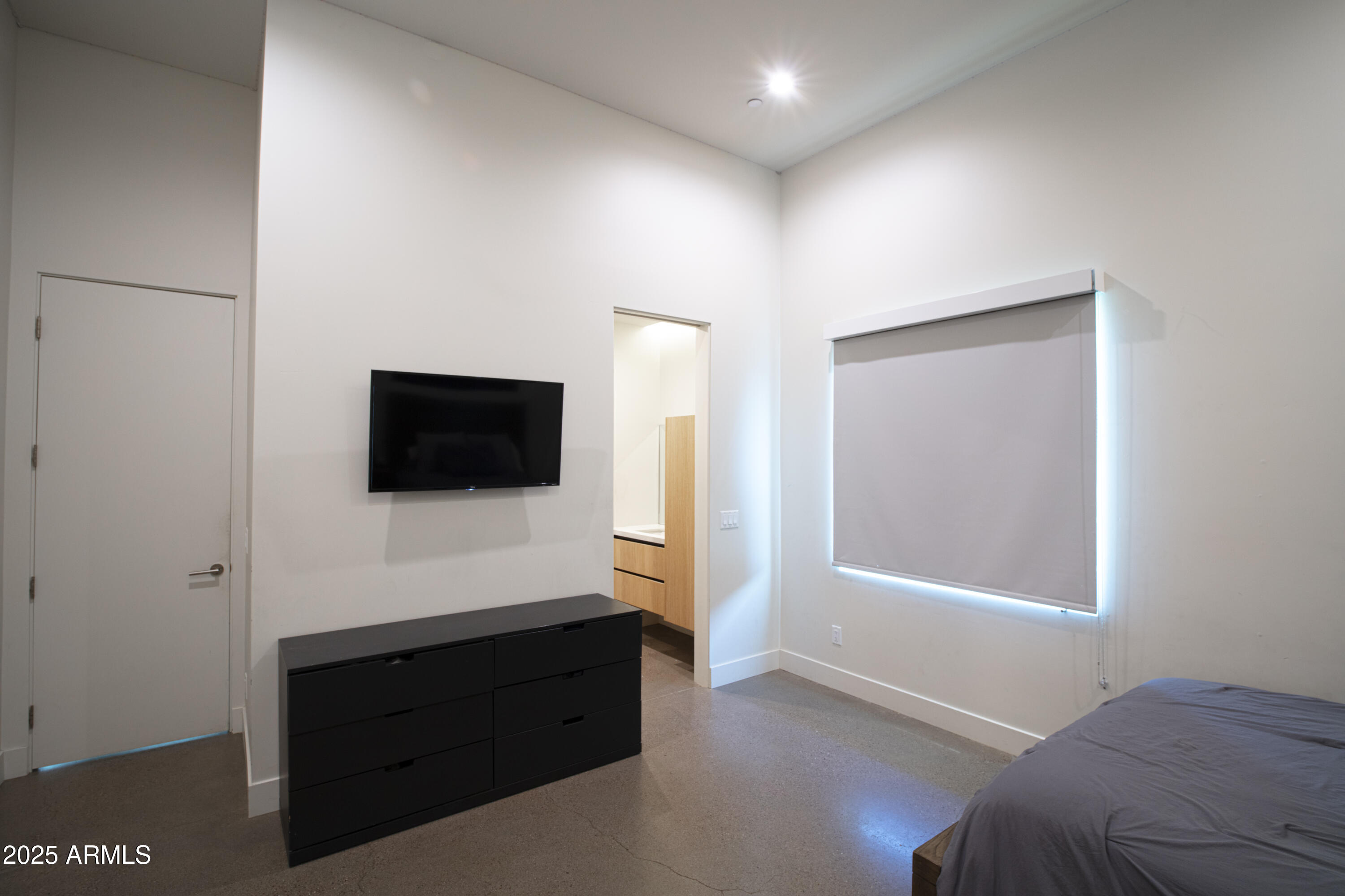 10310 North 37th Street Phoenix, AZ 85028 - Photo 36 of 51 a bedroom with a bed and a television