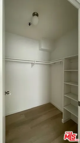 a view of an empty walk in closet