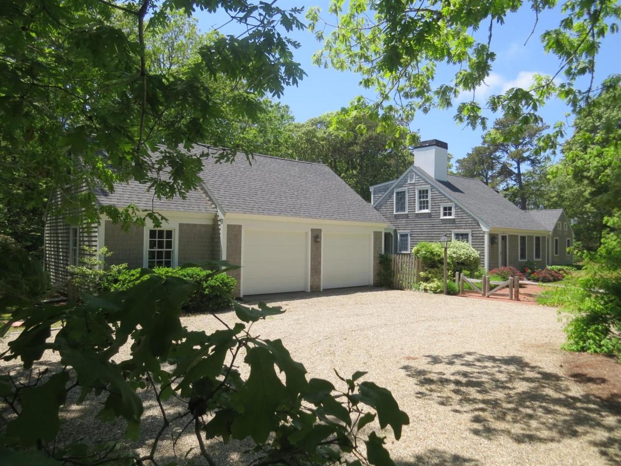 80 Middle Road Chatham, MA 02650 - Photo 3 of 21 a front view of a house with a yard and garage