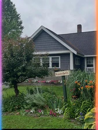 a front view of a house with a yard