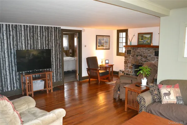 a living room with furniture and a fireplace