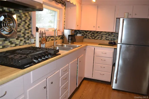 a living room with a fireplace and a flat screen tv