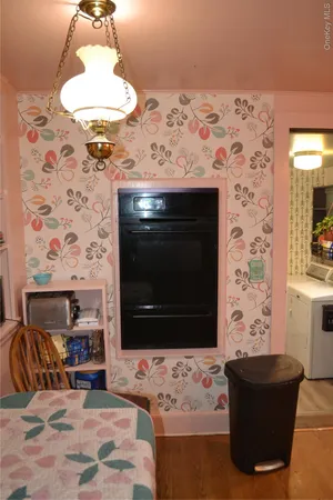 a bathroom with a sink a toilet a mirror and shower