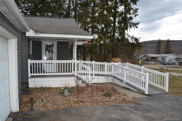 a view of a yard with large trees