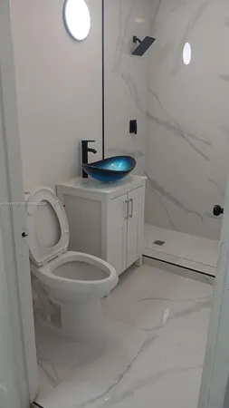 a bathroom with a toilet and a sink