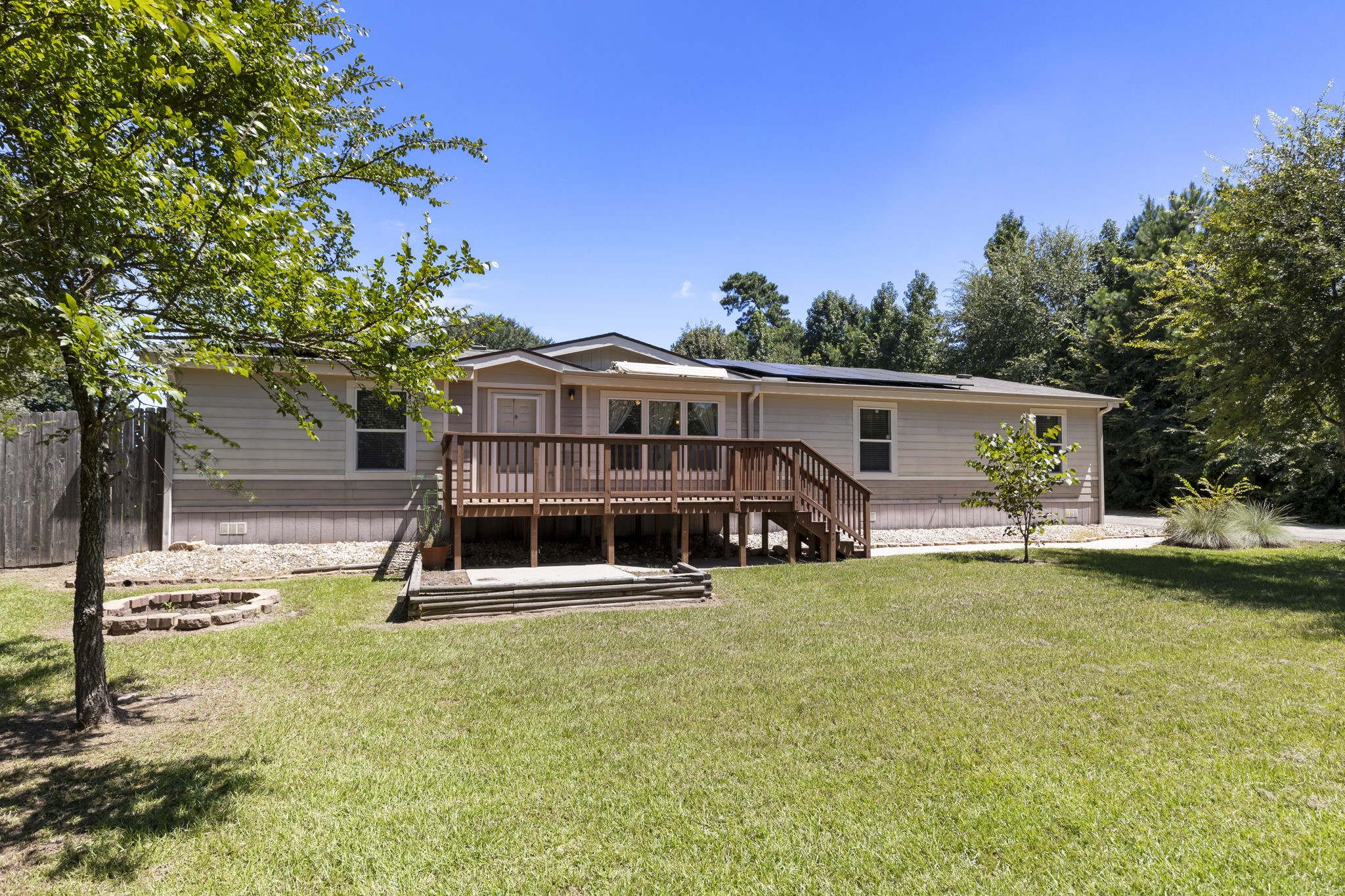 a view of a house with swimming pool and sitting area