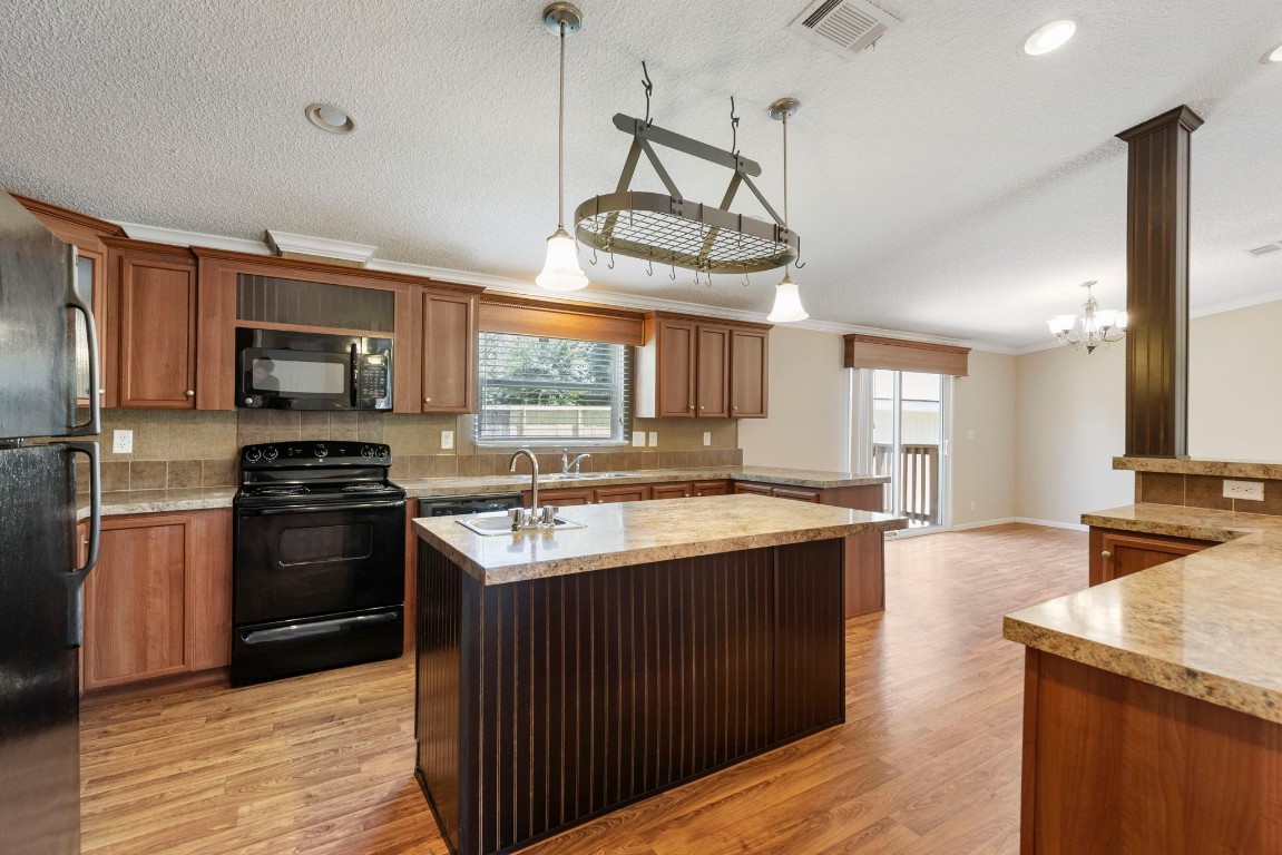 25330 Settlers Mill Road Magnolia, TX 77355 - Photo 13 of 21 a kitchen with stainless steel appliances granite countertop a stove and a sink