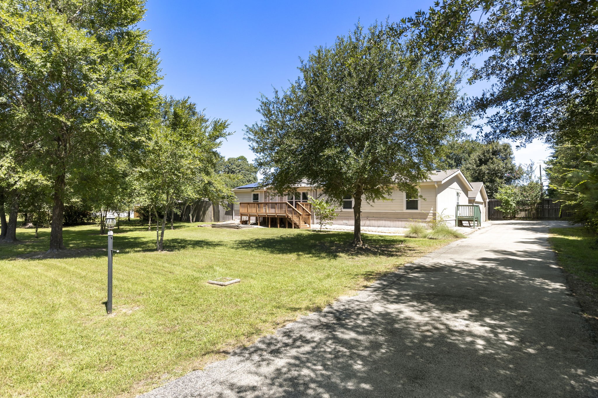 25330 Settlers Mill Road Magnolia, TX 77355 - Photo 18 of 21 a view of a yard with a house