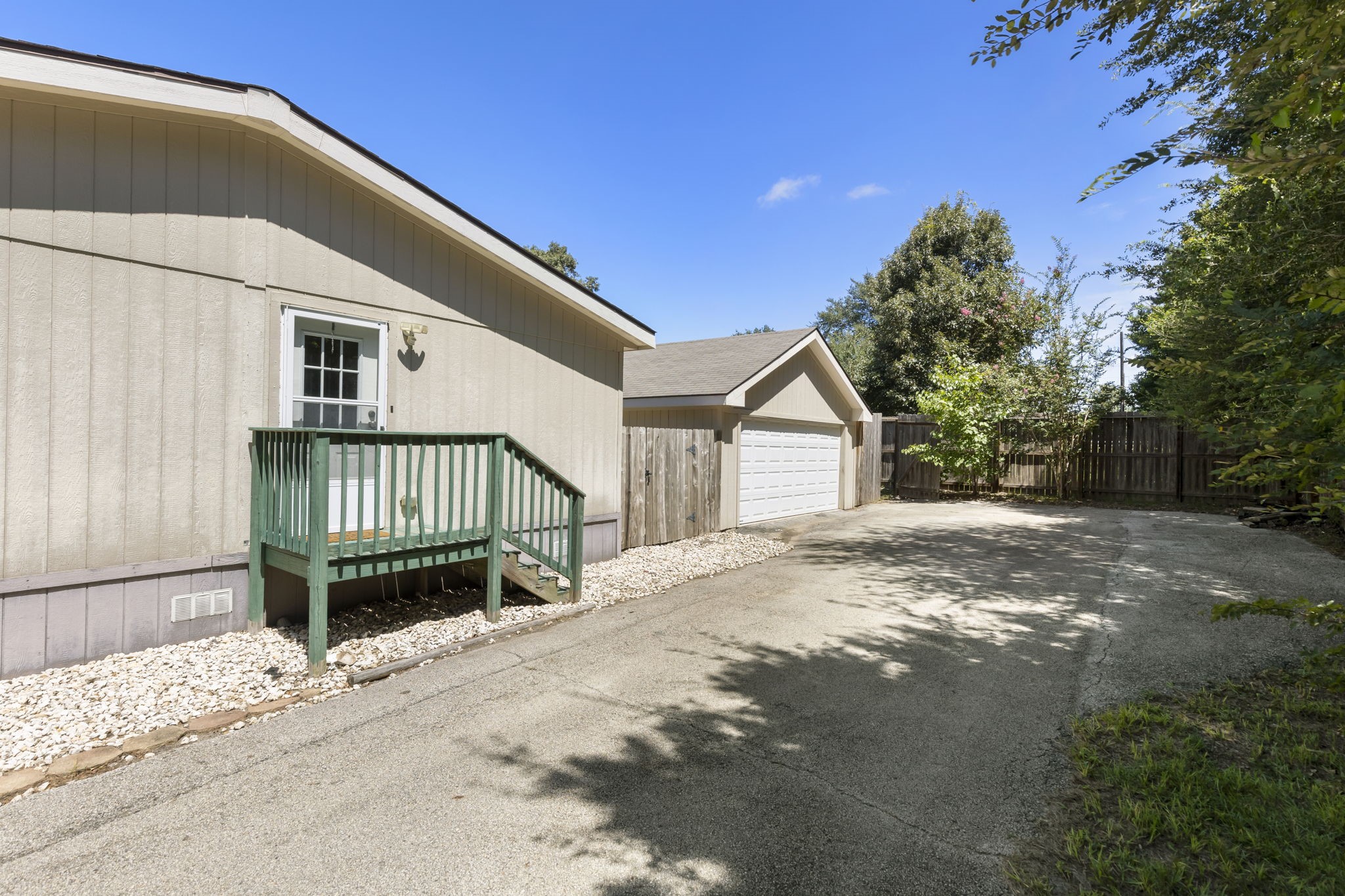 25330 Settlers Mill Road Magnolia, TX 77355 - Photo 19 of 21 a view of a house with a yard and wooden fence