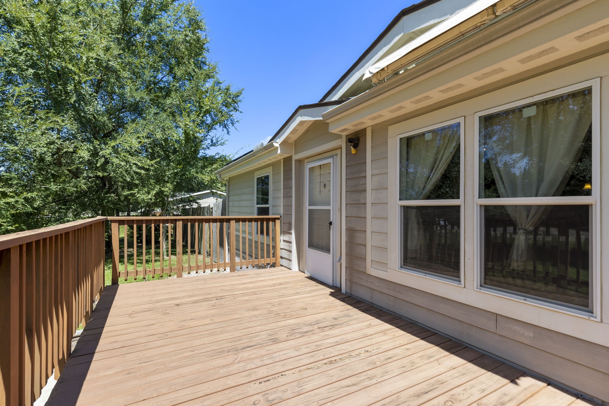 25330 Settlers Mill Road Magnolia, TX 77355 - Photo 3 of 21 a balcony with wooden floor and fence