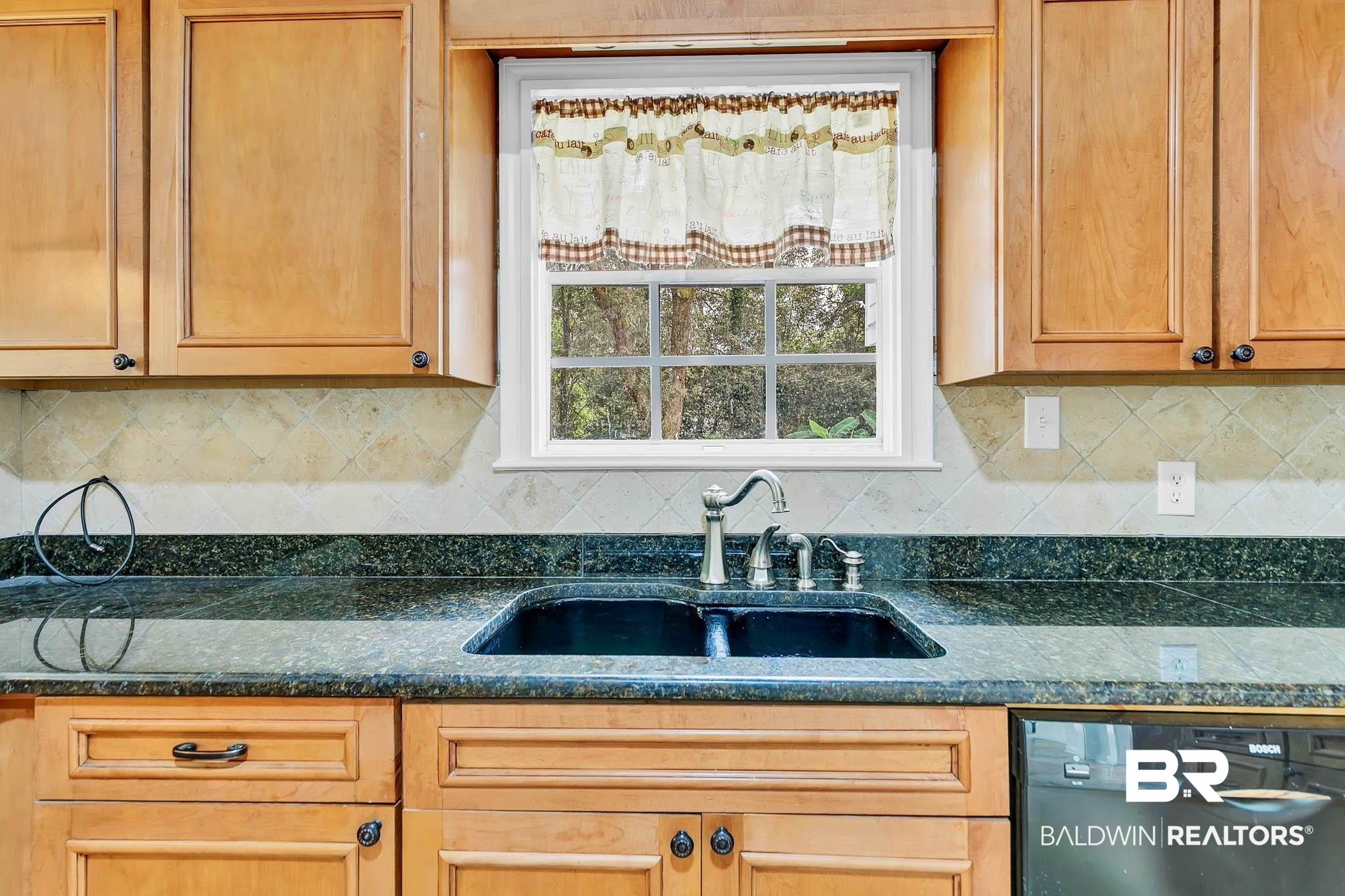 4705 Sherry Court Mobile, AL 36693 - Photo 20 of 100 Kitchen with dishwasher, plenty of natural light, backsplash, and dark stone countertops