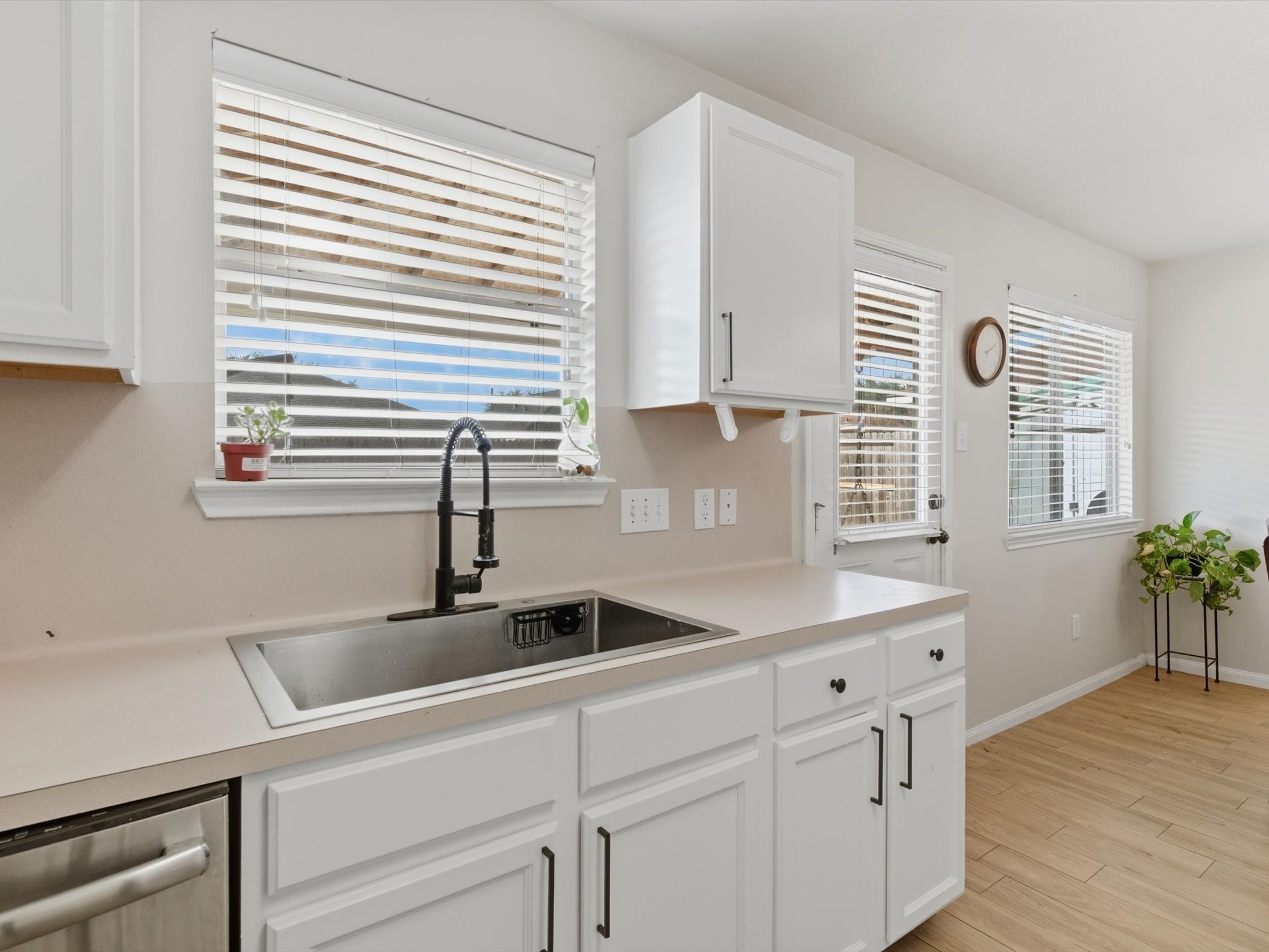 21631 Falvel Misty Drive Spring, TX 77388 - Photo 11 of 29 a kitchen with stainless steel appliances white cabinets and a window