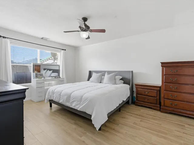 a bedroom with a bed and a dresser