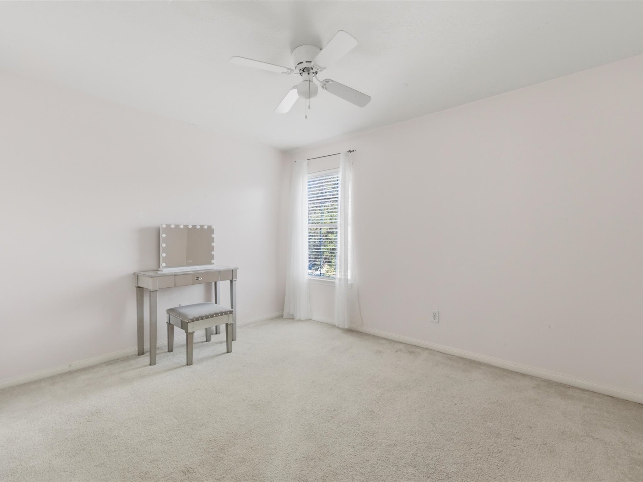 21631 Falvel Misty Drive Spring, TX 77388 - Photo 18 of 29 an empty room with a window and a ceiling fan