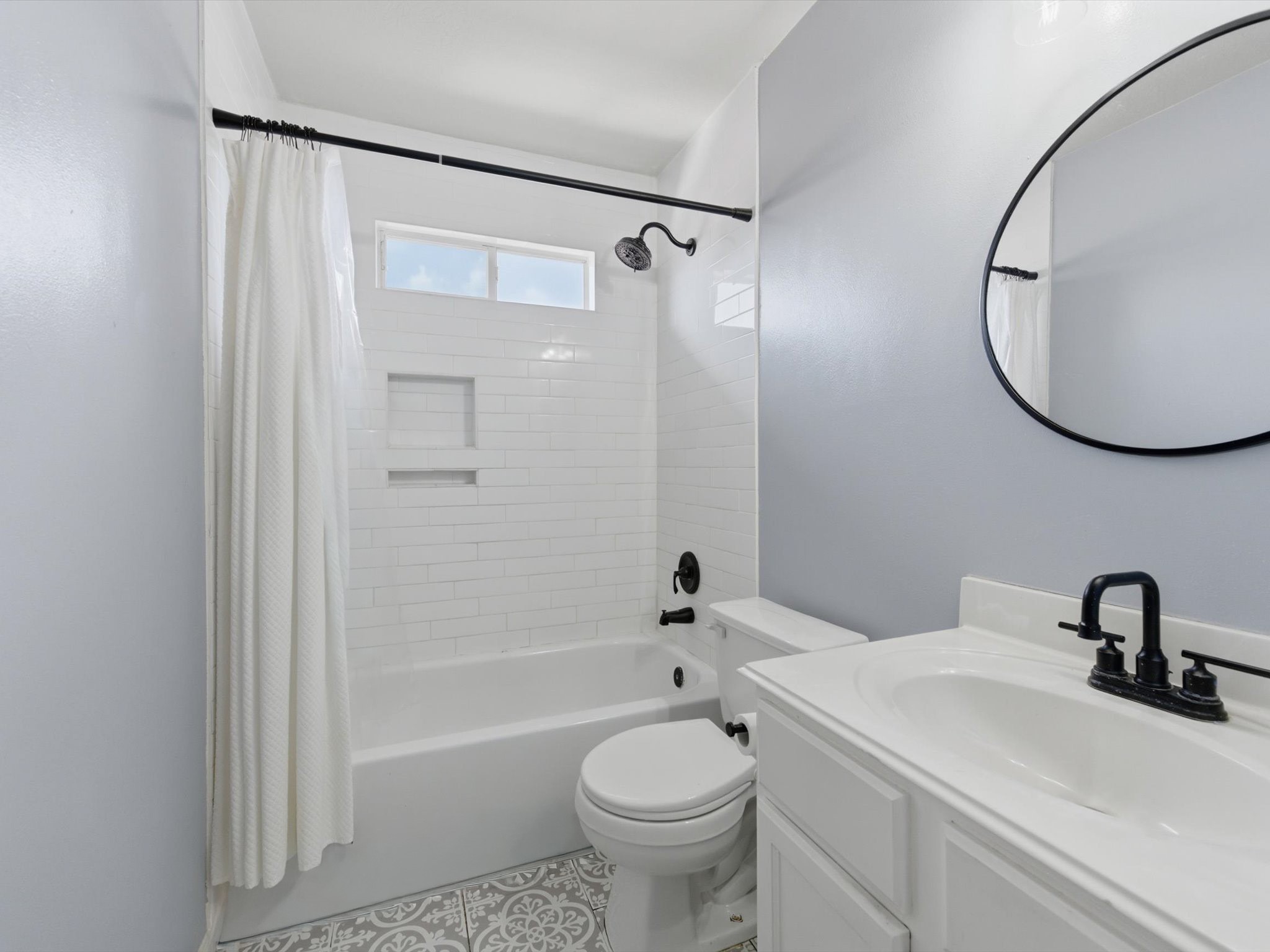 21631 Falvel Misty Drive Spring, TX 77388 - Photo 19 of 29 a bathroom with a sink a toilet and a mirror