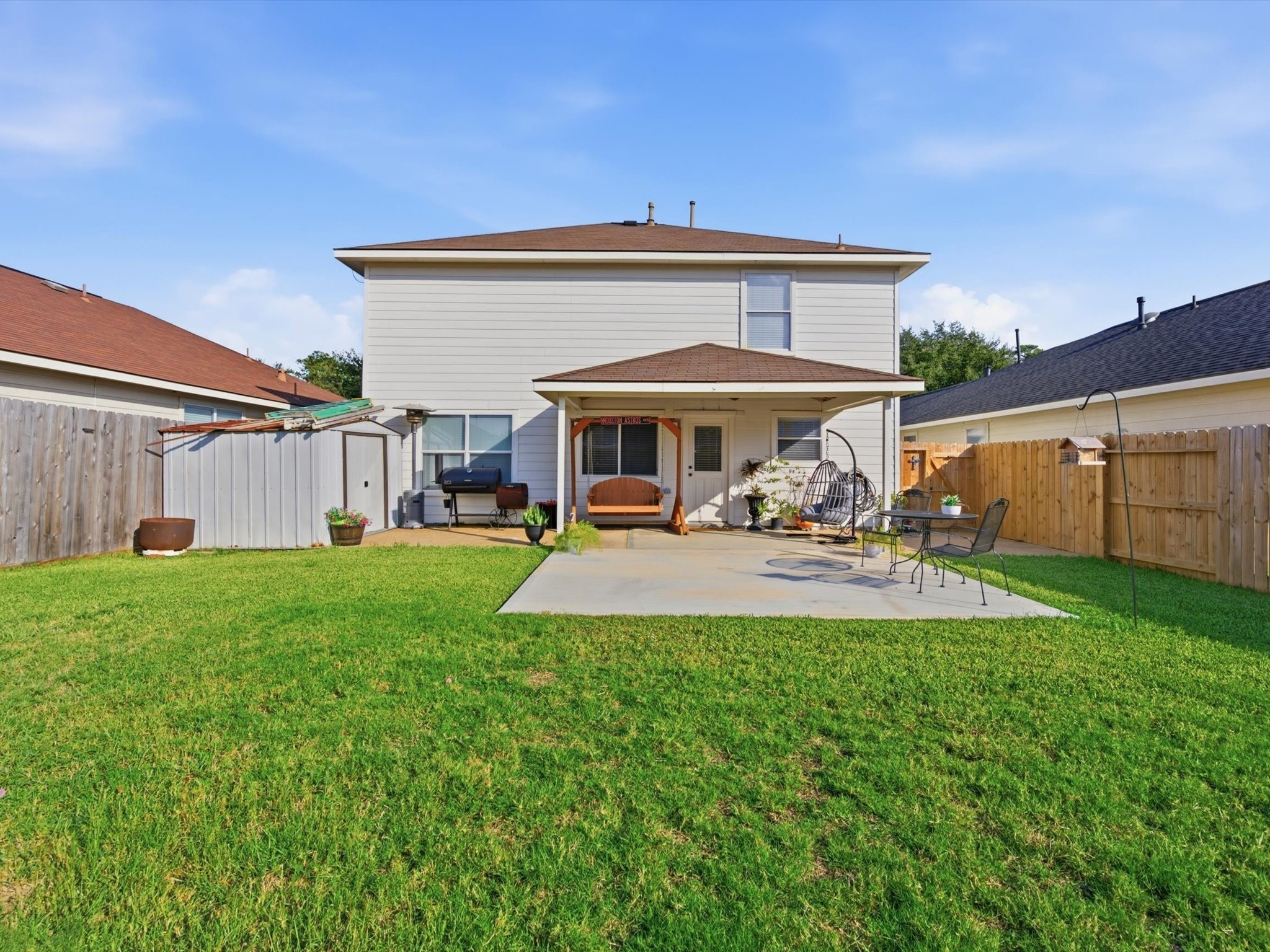 21631 Falvel Misty Drive Spring, TX 77388 - Photo 24 of 29 a view of a patio with table and chairs under an umbrella