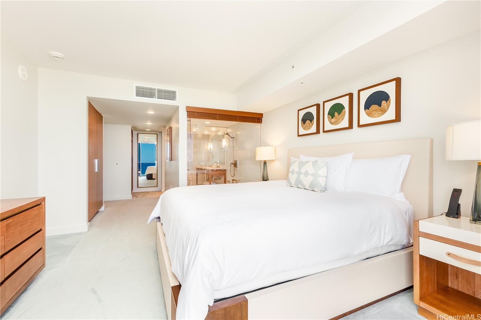 2139 Kūhiō Avenue, Unit 34 Honolulu, HI 96815 - Photo 14 of 25 a spacious bedroom with a bed and a cabinets