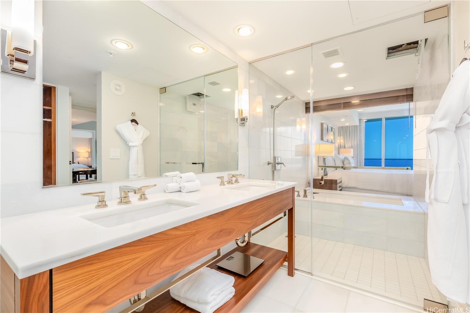 2139 Kūhiō Avenue, Unit 34 Honolulu, HI 96815 - Photo 15 of 25 a bathroom with a double vanity sink mirror and double