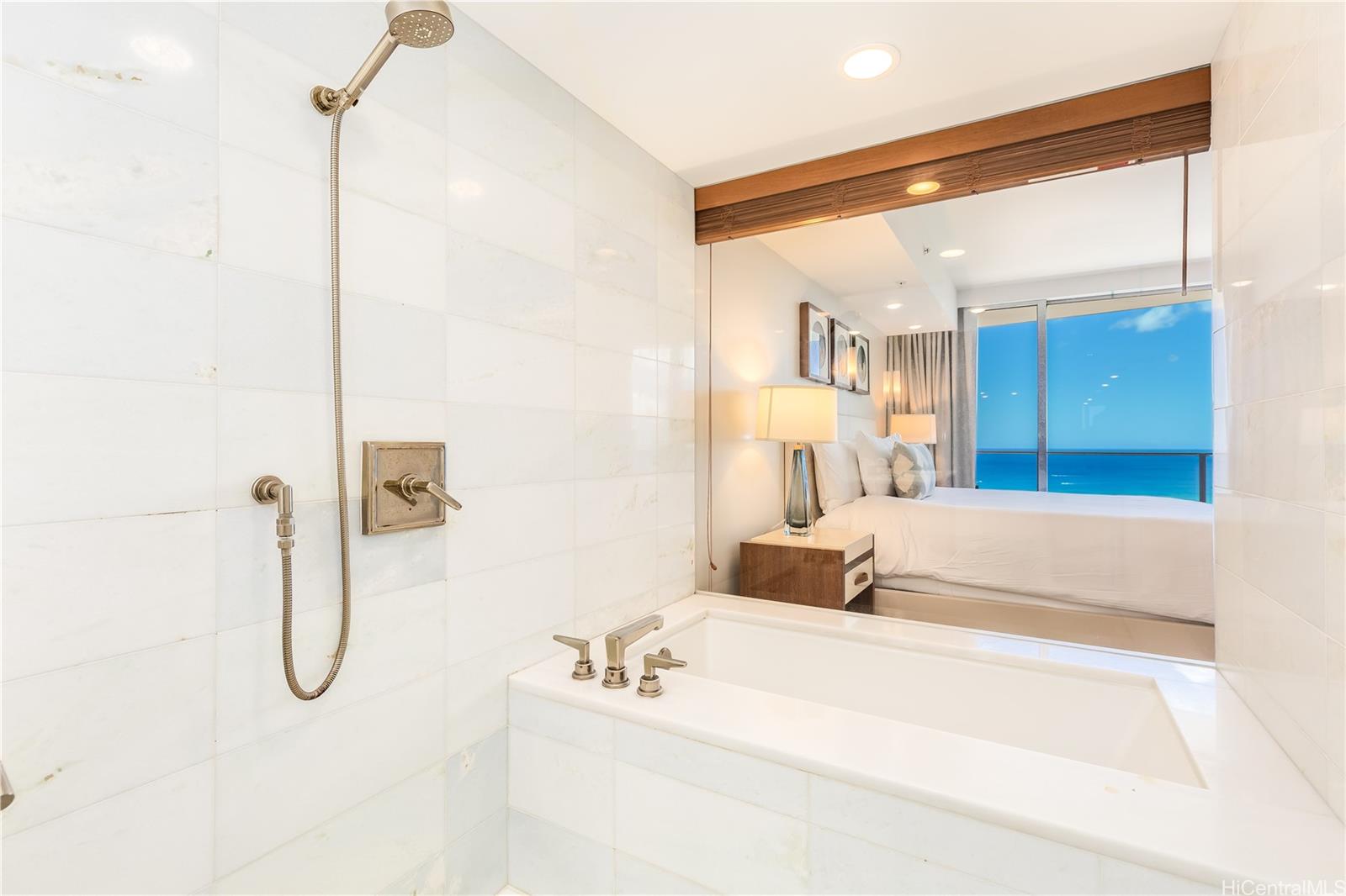 2139 Kūhiō Avenue, Unit 34 Honolulu, HI 96815 - Photo 16 of 25 a bathroom with a tub sink and shower