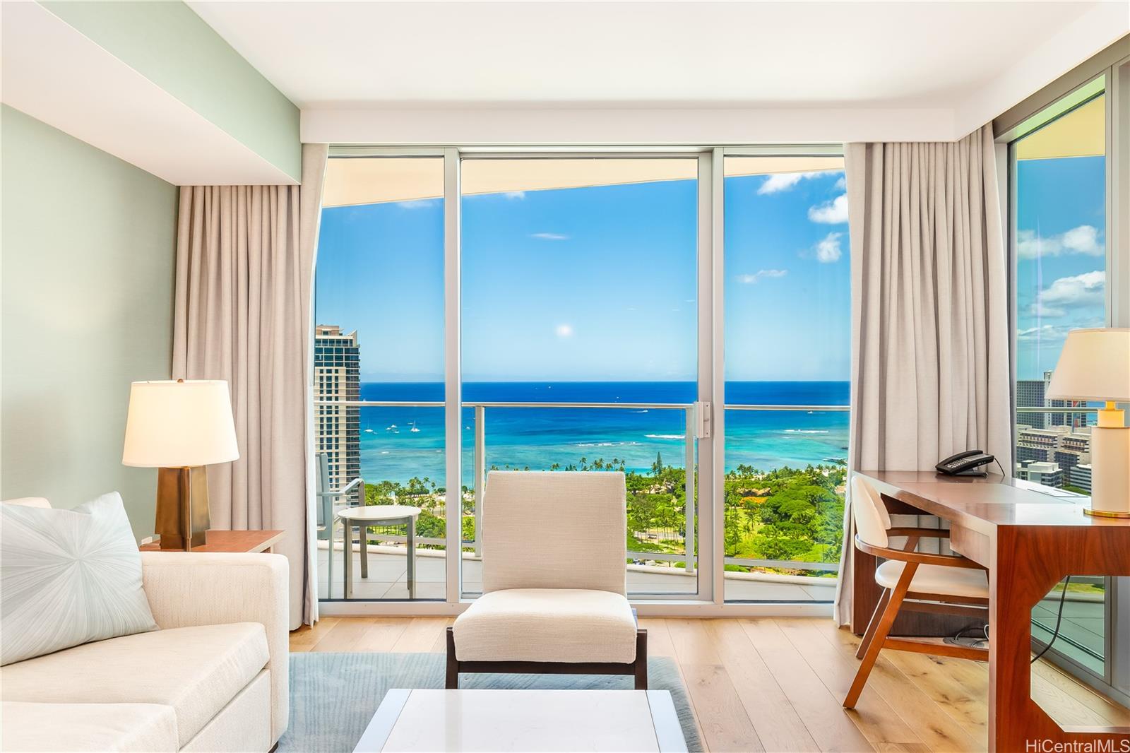 2139 Kūhiō Avenue, Unit 34 Honolulu, HI 96815 - Photo 4 of 25 a living room with furniture and a large window