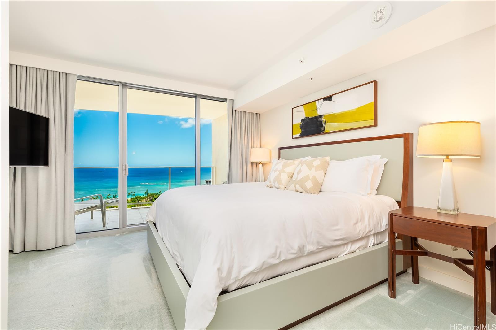 2139 Kūhiō Avenue, Unit 34 Honolulu, HI 96815 - Photo 10 of 25 a bedroom with a bed and a view of walk in closet