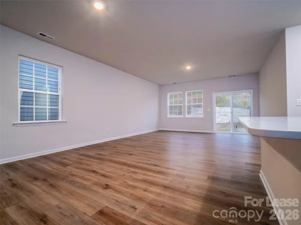 a view of kitchen with wooden floor