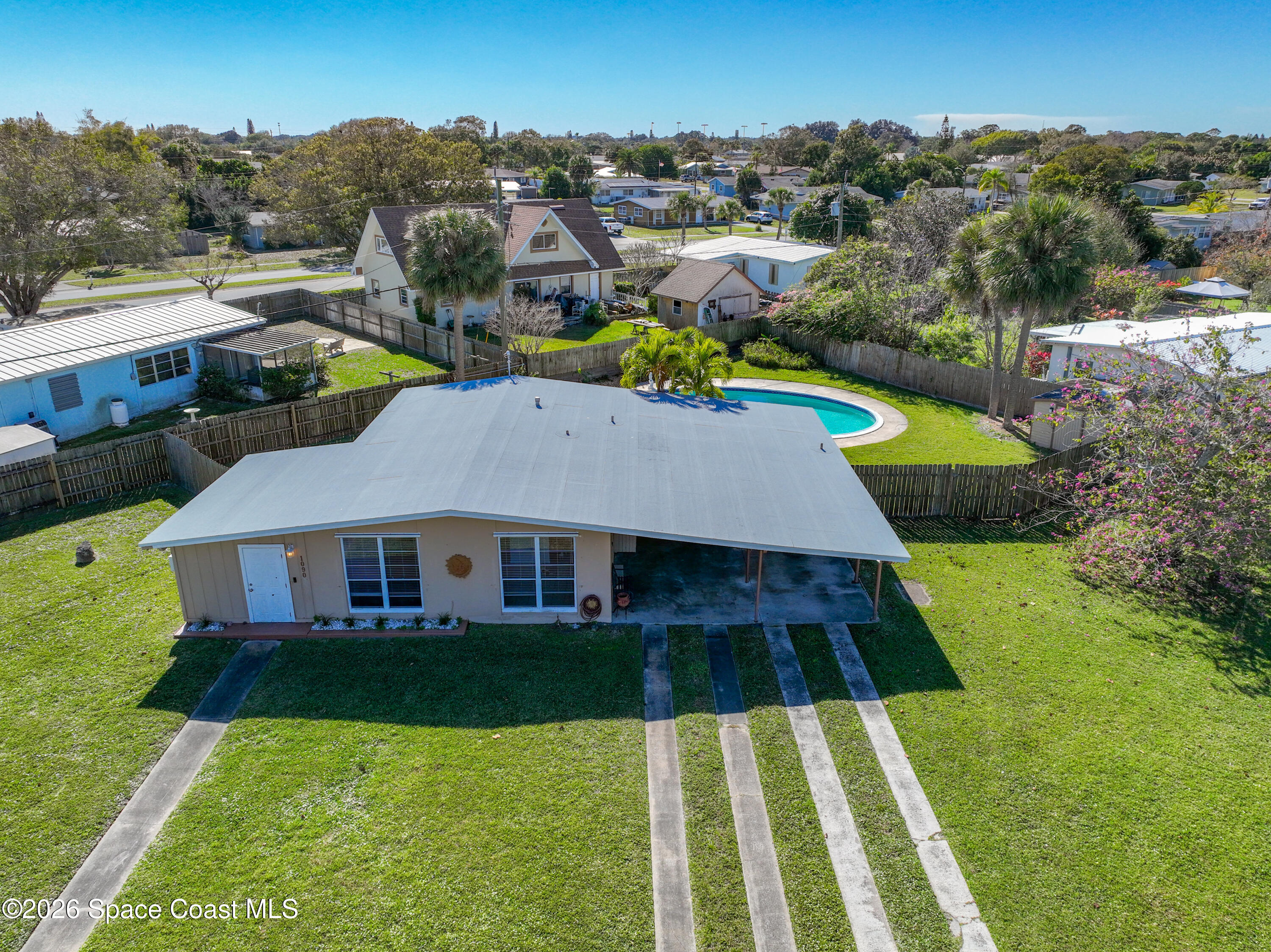 1090 Bianca Drive Northeast Palm Bay, FL 32905 - Photo 1 of 30 an aerial view of a house with swimming pool garden and mountain view