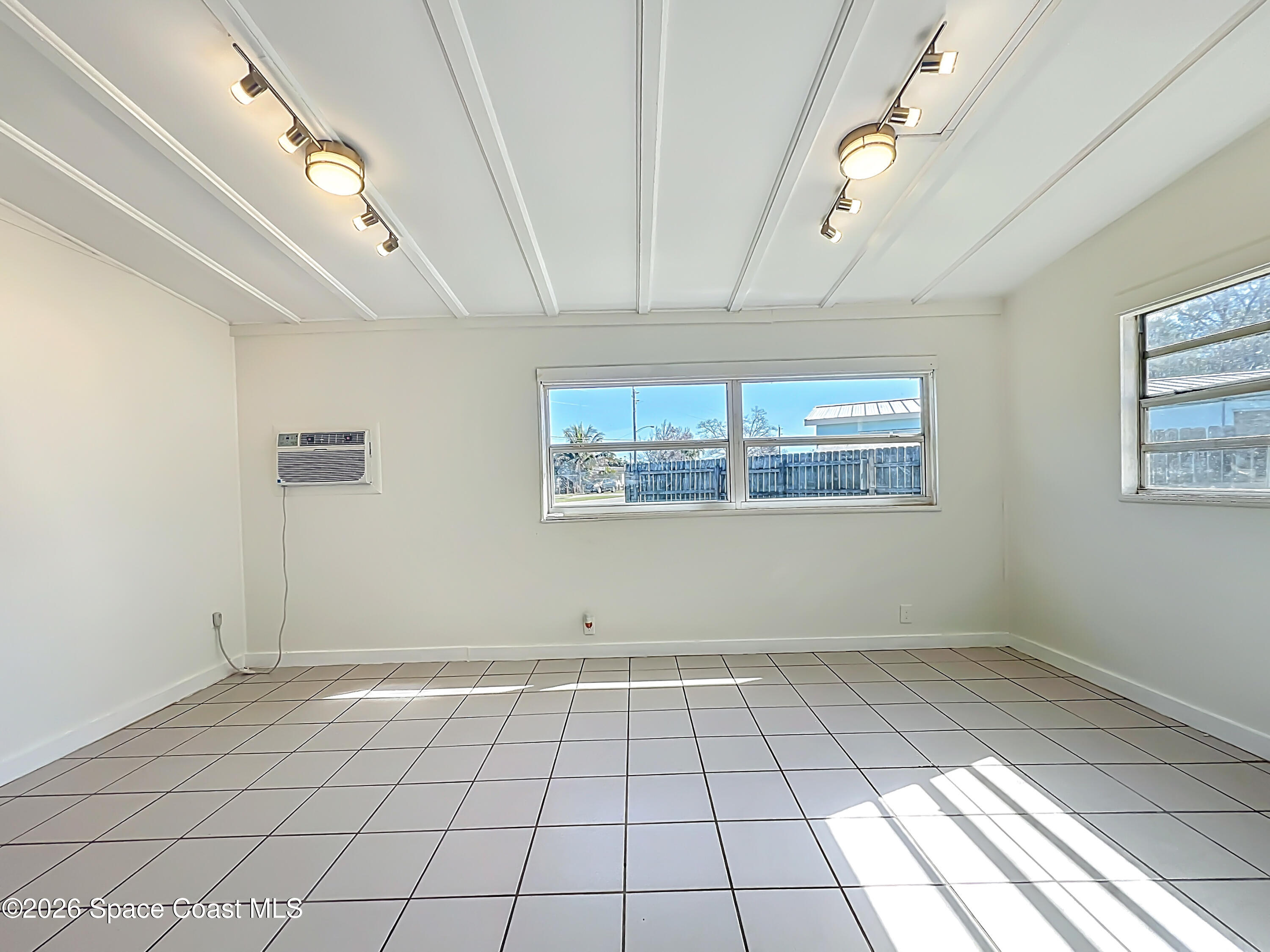 1090 Bianca Drive Northeast Palm Bay, FL 32905 - Photo 11 of 30 a view of an empty room with a window
